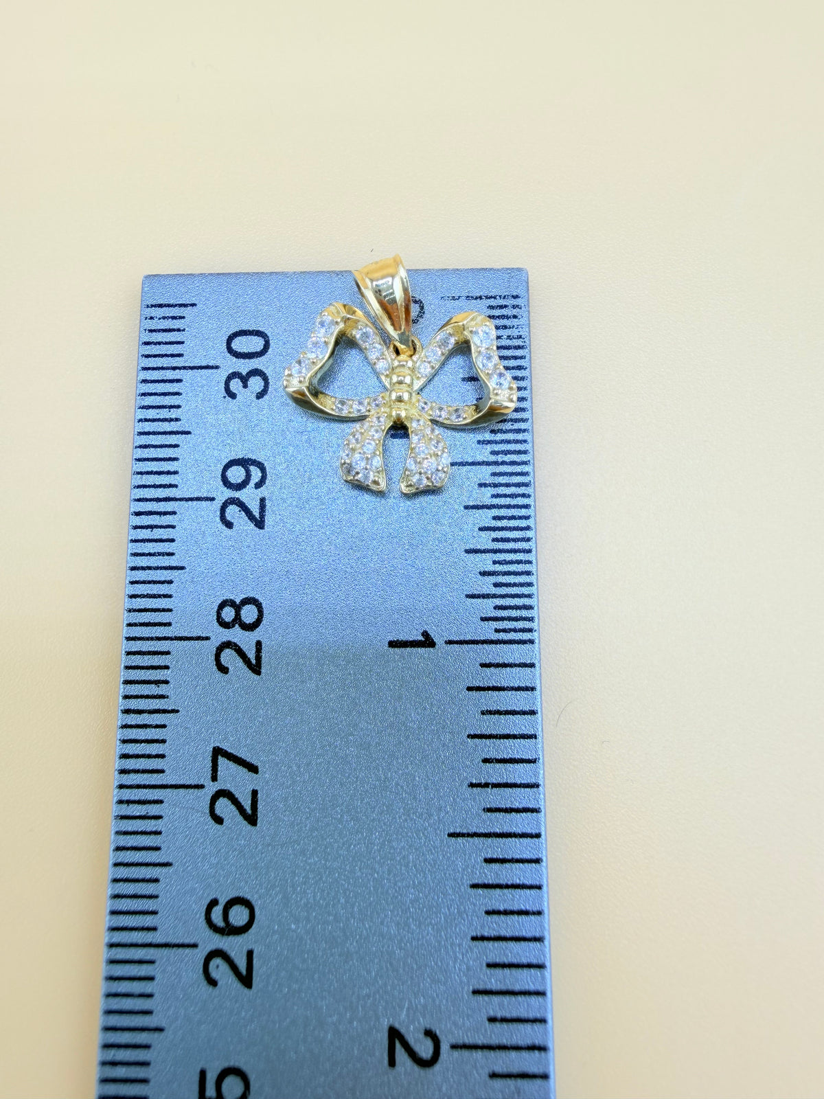 10K Gold Bow Pendant, Fits Chains Up to 3mm Thick. ch