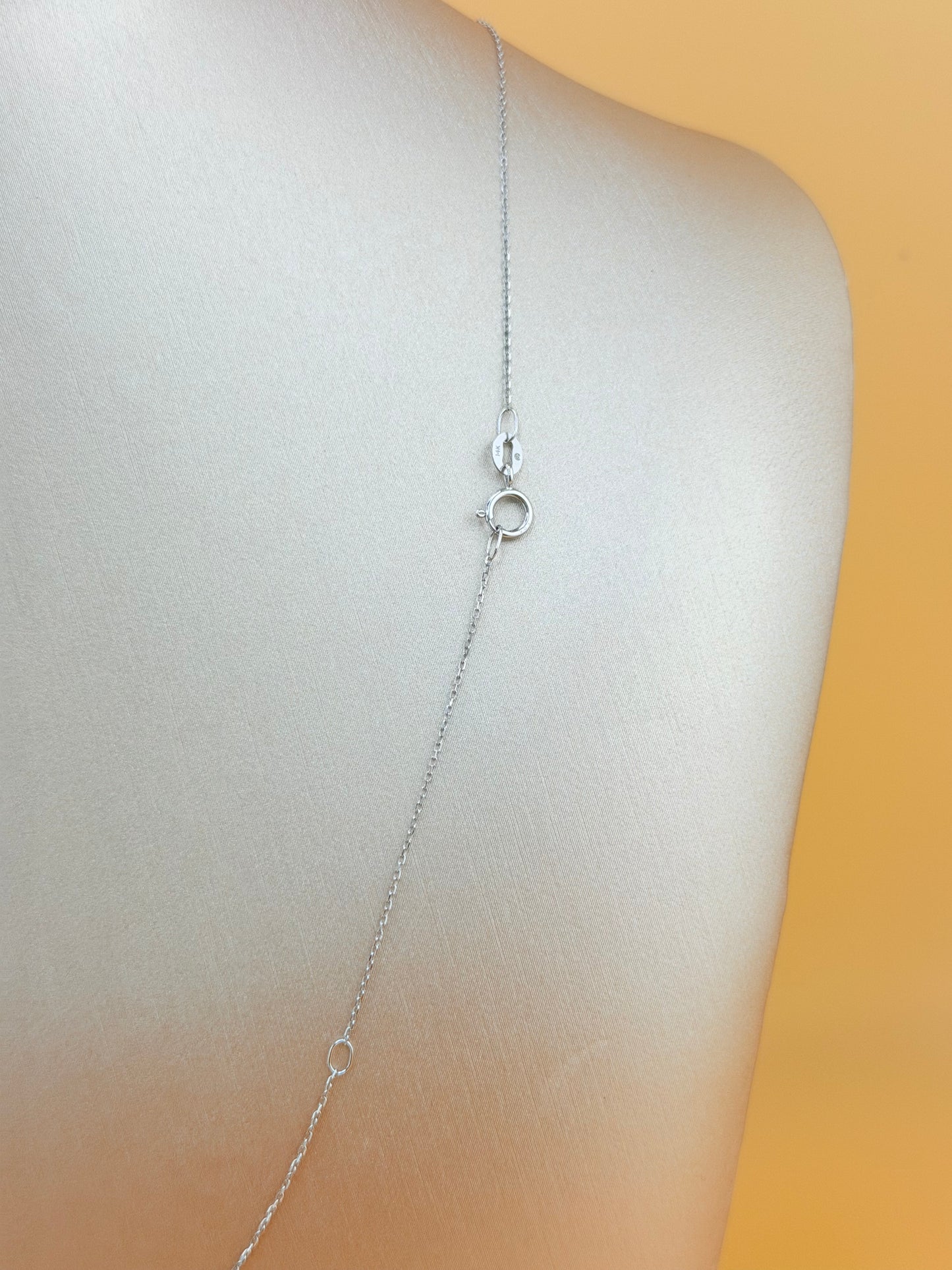 14kt gold necklace with a Turkish Evil Eye pendant, featuring natural diamonds and sapphire. 0.16 ct of natural diamonds and 0.07 ct of sapphire. Adjustable length: 16”–18”.