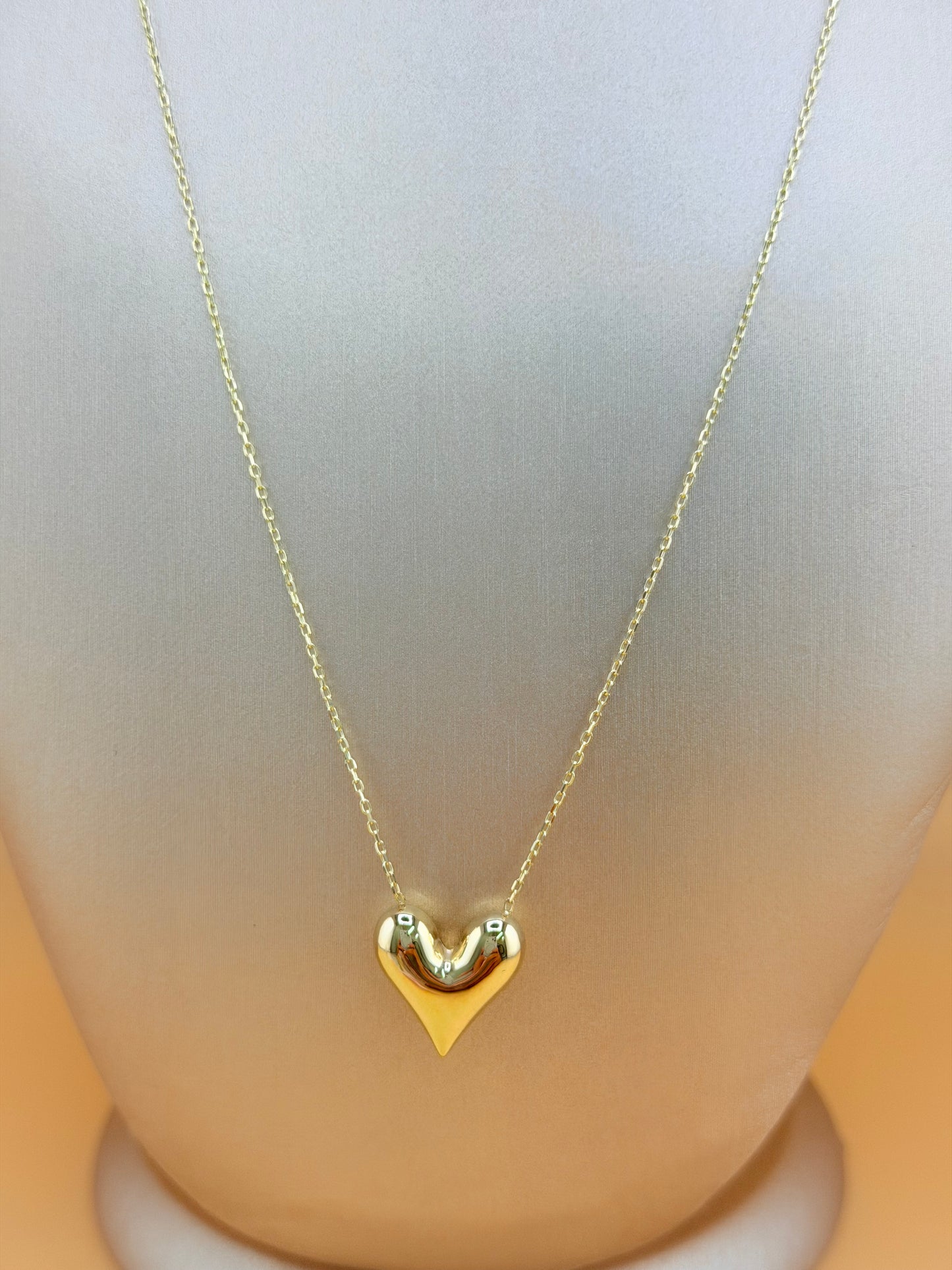 10kt Gold Necklace with a Puffed Heart Pendant, adjustable size 16”–18”.