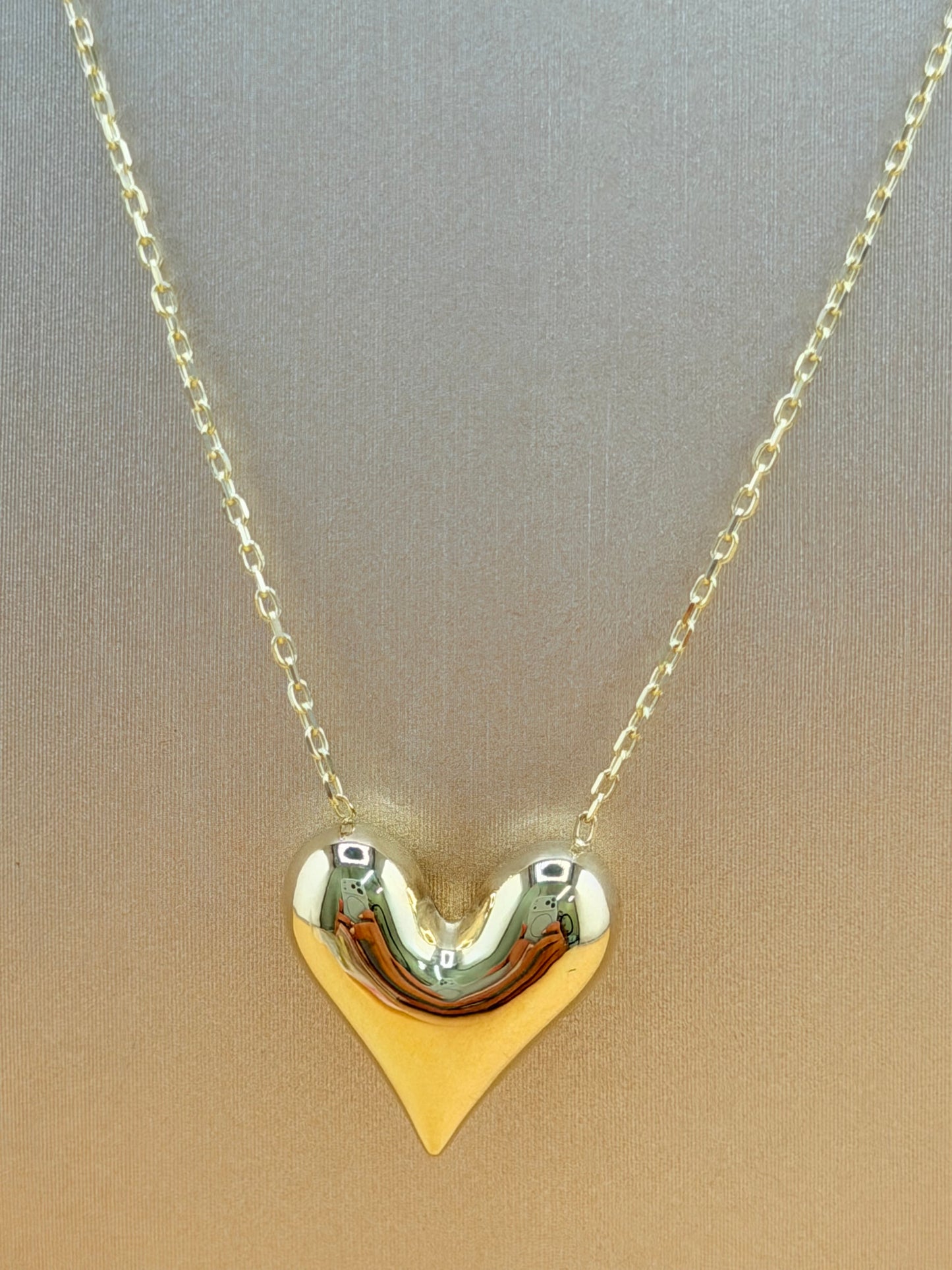 10kt Gold Necklace with a Puffed Heart Pendant, adjustable size 16”–18”.