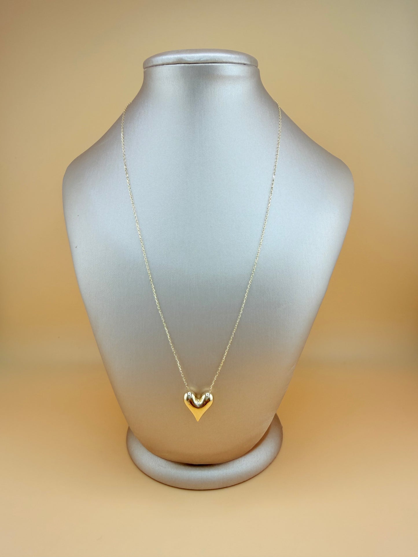 10kt Gold Necklace with a Puffed Heart Pendant, adjustable size 16”–18”.
