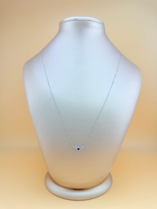 14kt gold necklace with a Turkish Evil Eye pendant, featuring natural diamonds and sapphire. 0.16 ct of natural diamonds and 0.07 ct of sapphire. Adjustable length: 16”–18”.